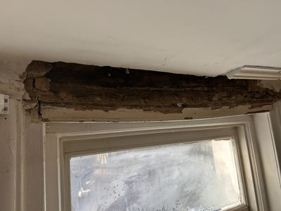Rotten timber lintel before replacement