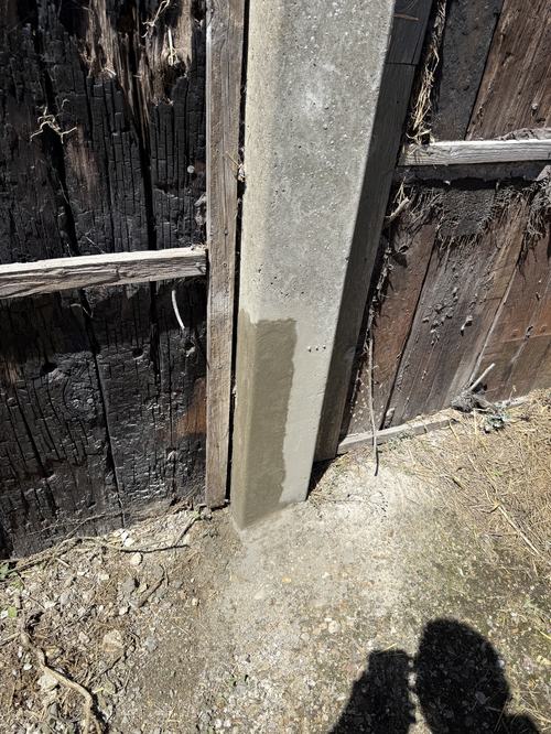 Concrete repair to barn columns showing spalling and exposed rebar