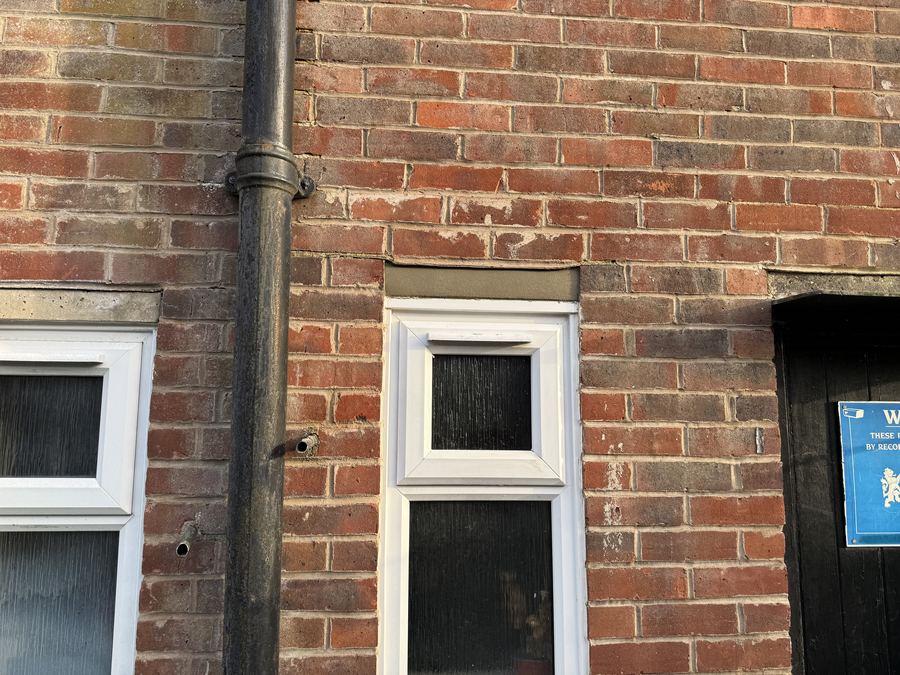 Reinstated lintel finish, parade of shops, Polegate